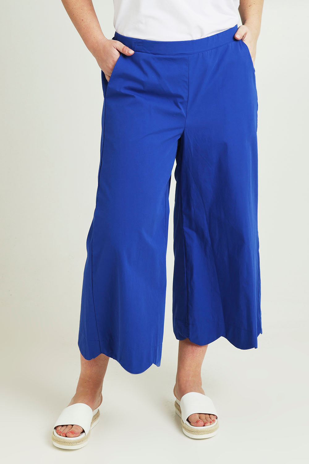 Model Jane wearing size 14 of the Scalloped Hem Cotton Pant in colour Palaceblue (Blue), from the front, cropped image