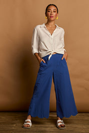 Model Katie wearing size 10 of the Scalloped Hem Cotton Pant in colour Palaceblue (Blue), from the front, showing the whole outfit