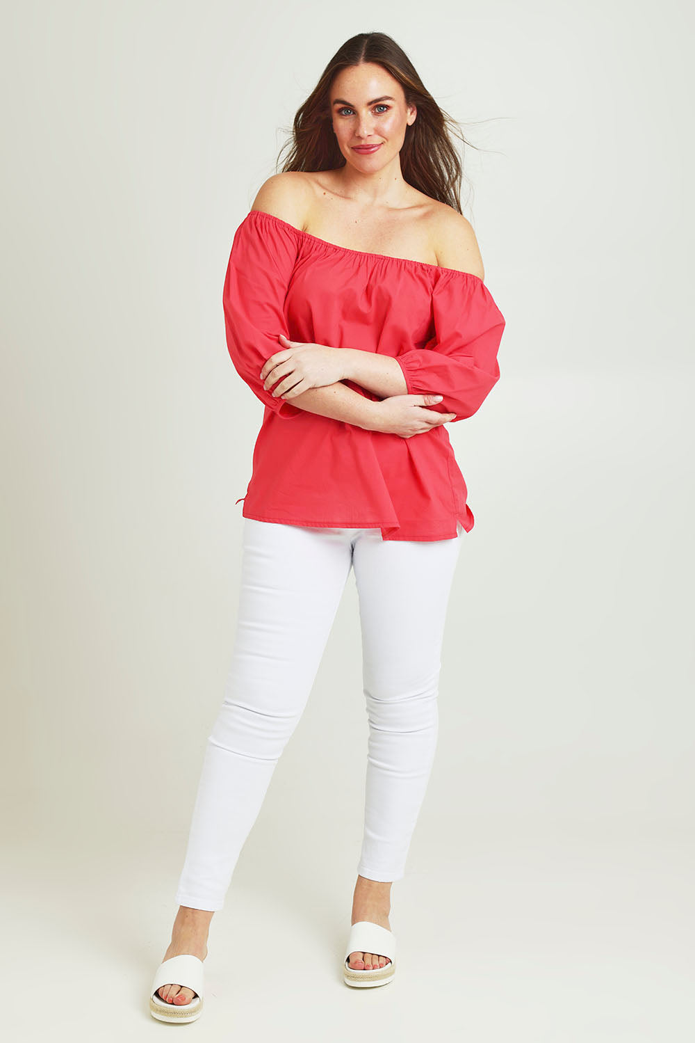 Model Jane wearing size 14 of the On Or Off The Shoulder Cotton Blouse in colour Hibiscus, from the front, showing the whole outfit