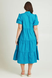 Model Jane wearing size 14 of the Tiered Cotton Dress in colour Jewel (Blue), from the back