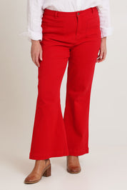 Model Chanel wearing size 16 of the Denim Patch Pocket Jean in colour Red (Red), from the front, cropped image