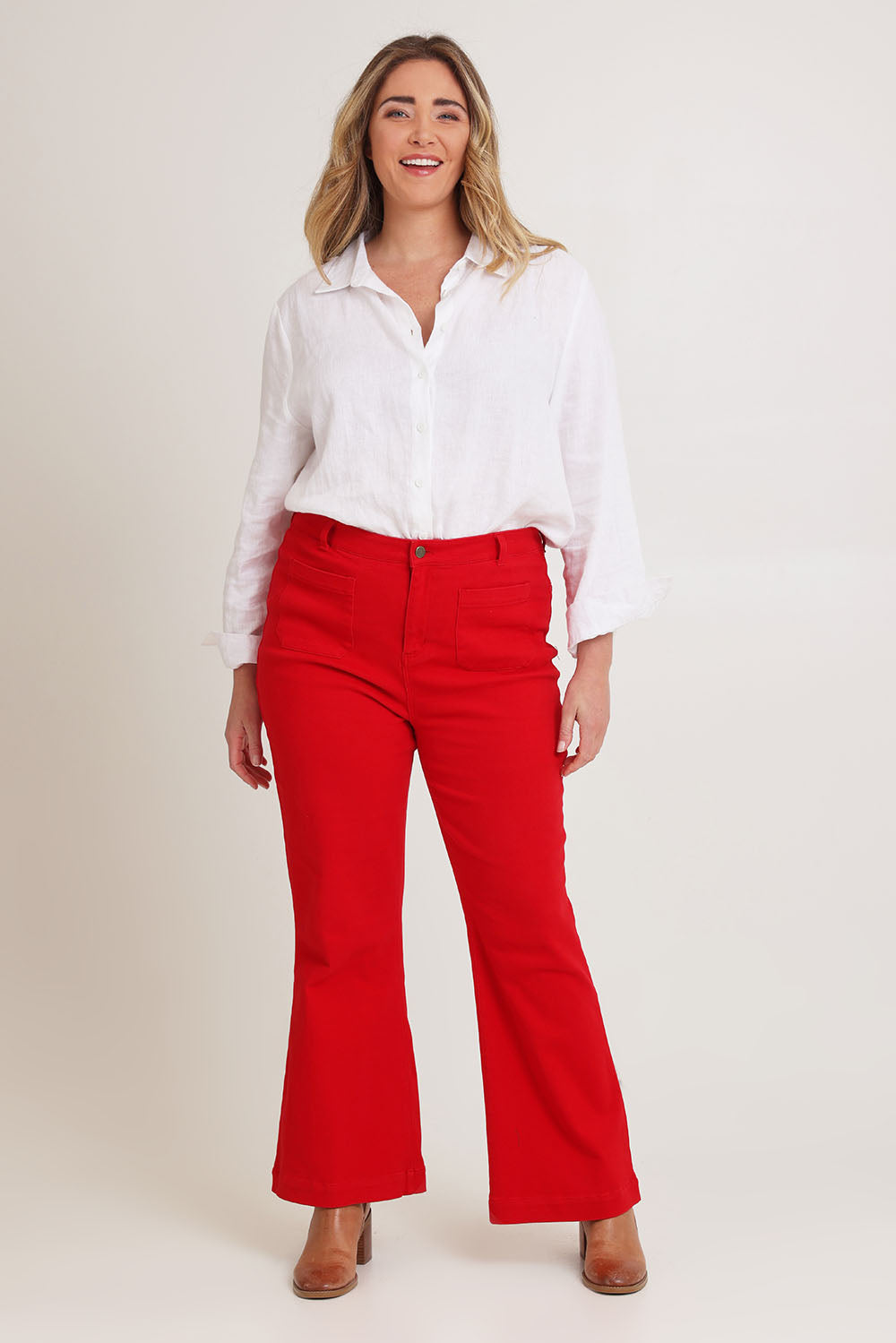 Model Chanel wearing size 16 of the Denim Patch Pocket Jean in colour Red (Red), from the front, showing the whole outfit