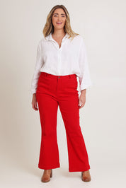 Model Chanel wearing size 16 of the Denim Patch Pocket Jean in colour Red (Red), from the front, showing the whole outfit