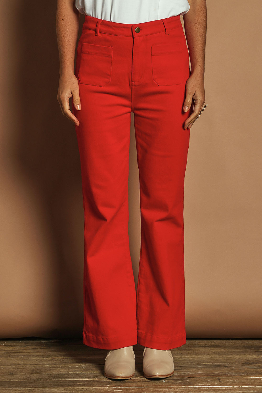 Model Katie wearing size 10 of the Denim Patch Pocket Jean in colour Red (Red), from the front, cropped image