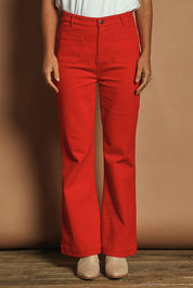 Model Katie wearing size 10 of the Denim Patch Pocket Jean in colour Red (Red), from the front, cropped image