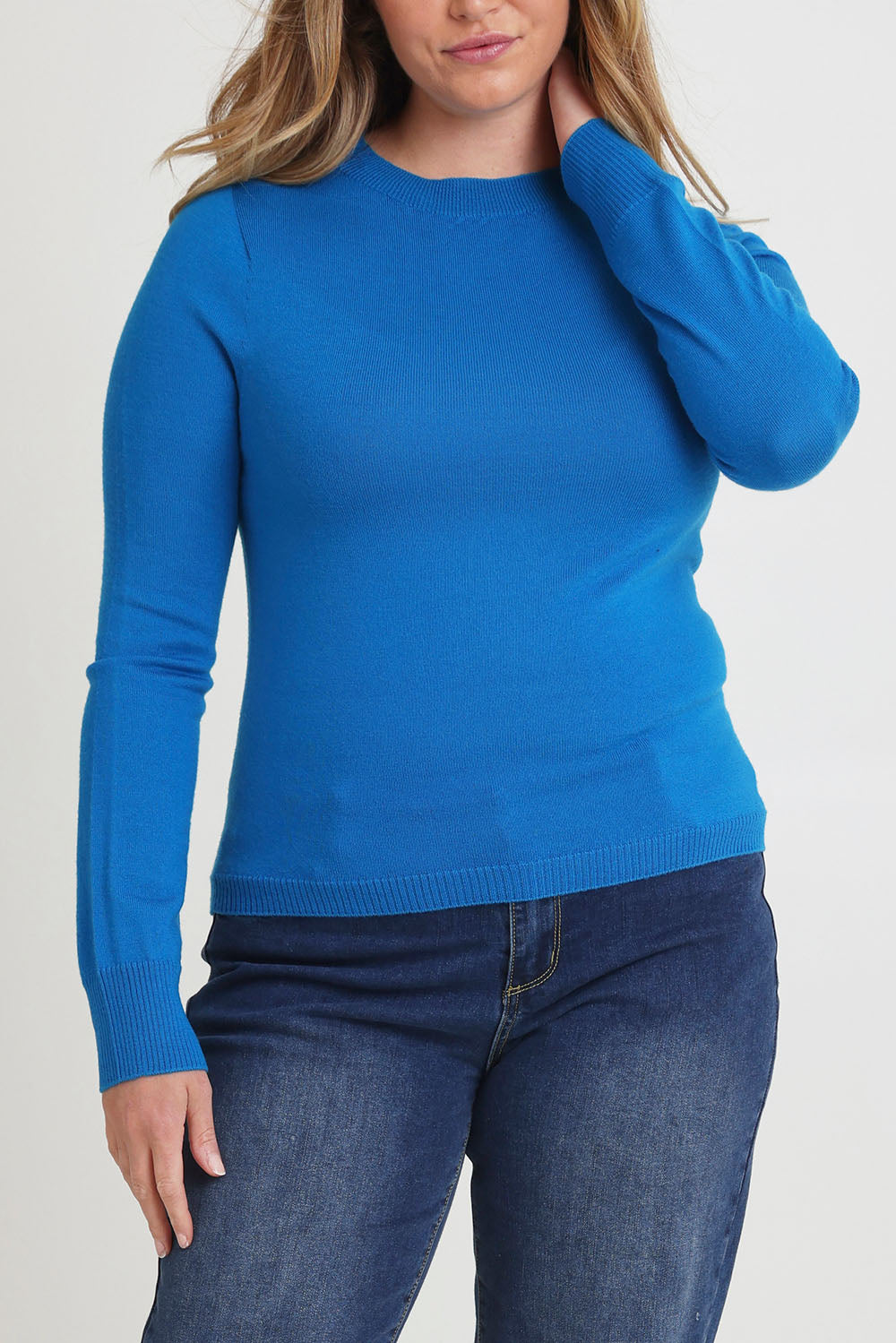 Model Chanel wearing size XL of the Extra Fine Merino Wool Long Sleeve Knit in colour Blue (Blue), from the front, cropped image