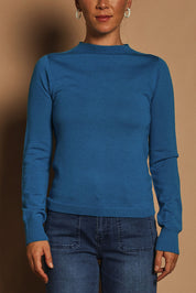 Model Katie wearing size S of the Extra Fine Merino Wool Long Sleeve Knit in colour Blue (Blue), from the front, cropped image