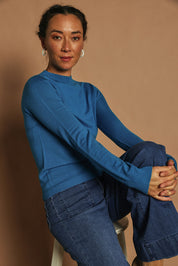 Model Katie wearing size S of the Extra Fine Merino Wool Long Sleeve Knit in colour Blue (Blue), from the front, showing the whole outfit