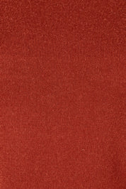 Product shot of the Extra Fine Merino Wool Long Sleeve Knit in colour Rust, detail