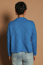 Model Katie wearing size S of the Diamond Crew Neck Sweater in colour Cobalt (Blue), from the back