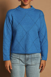 Model Katie wearing size S of the Diamond Crew Neck Sweater in colour Cobalt (Blue), from the front, cropped image