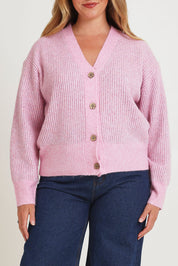 Model Chanel wearing size XL of the Fluffy Relaxed Ribbed Cardigan in colour Prismpink (Pink), from the front, cropped image