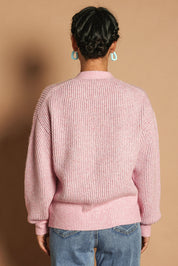 Model Katie wearing size S of the Fluffy Relaxed Ribbed Cardigan in colour Prismpink (Pink), from the back