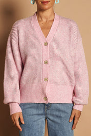 Model Katie wearing size S of the Fluffy Relaxed Ribbed Cardigan in colour Prismpink (Pink), from the front, cropped image