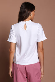 Model Madeline wearing size 10 of the Mercerised Cotton Frill Top in colour White (White), from the back