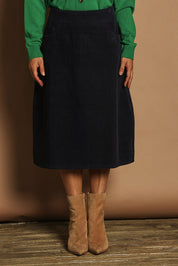 Model Katie wearing size 10 of the Cotton Corduroy A Line Skirt in colour Deepblue (Blue), from the front, cropped image