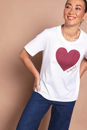 Model Katie wearing size 10 of the Mercerized Cotton Love Tee in colour Burgundy (Red), from the front, cropped image