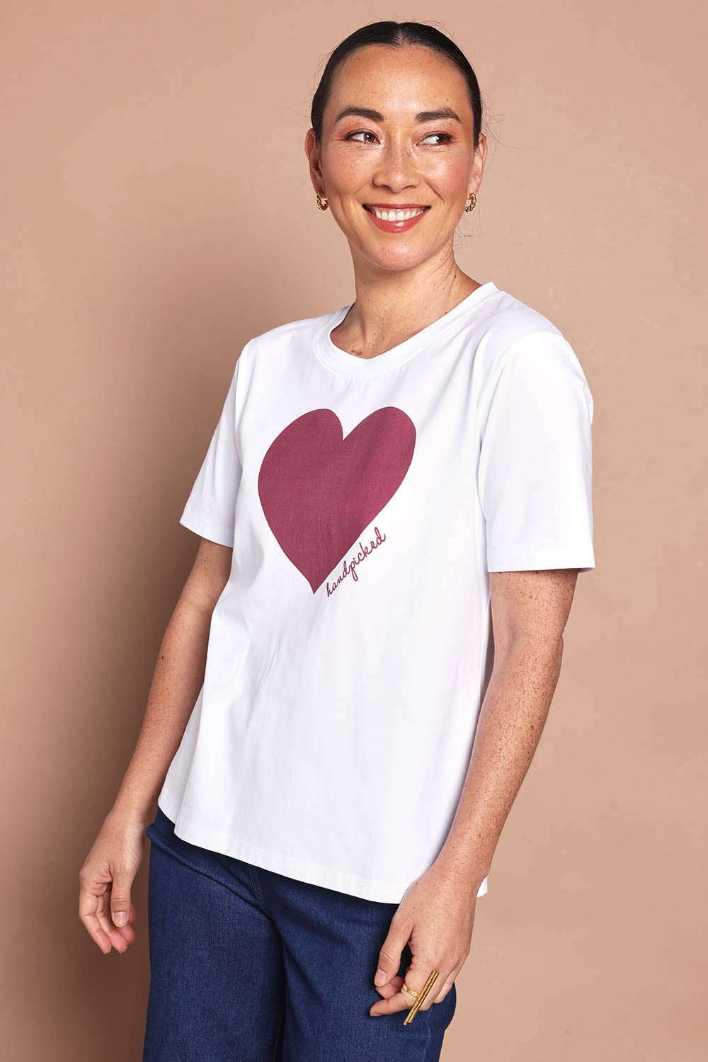 Model Katie wearing size 10 of the Mercerized Cotton Love Tee in colour Burgundy (Red), from the front, cropped image