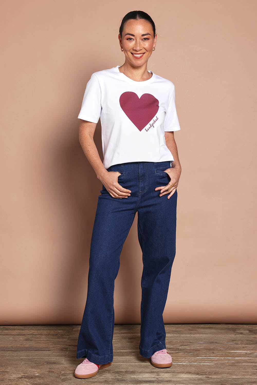 Model Katie wearing size 10 of the Mercerized Cotton Love Tee in colour Burgundy (Red), from the front, showing the whole outfit