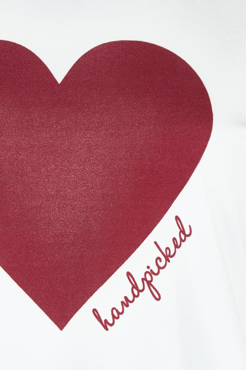 Product shot of the Mercerized Cotton Love Tee in colour Burgundy (Red), detail