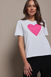Model Madeline wearing size 10 of the Mercerized Cotton Love Tee in colour Pinkheart (Pink), from the front, cropped image