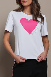 Model Madeline wearing size 10 of the Mercerized Cotton Love Tee in colour Pinkheart (Pink), from the front, cropped image
