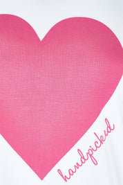 Product shot of the Mercerized Cotton Love Tee in colour Pinkheart (Pink), detail