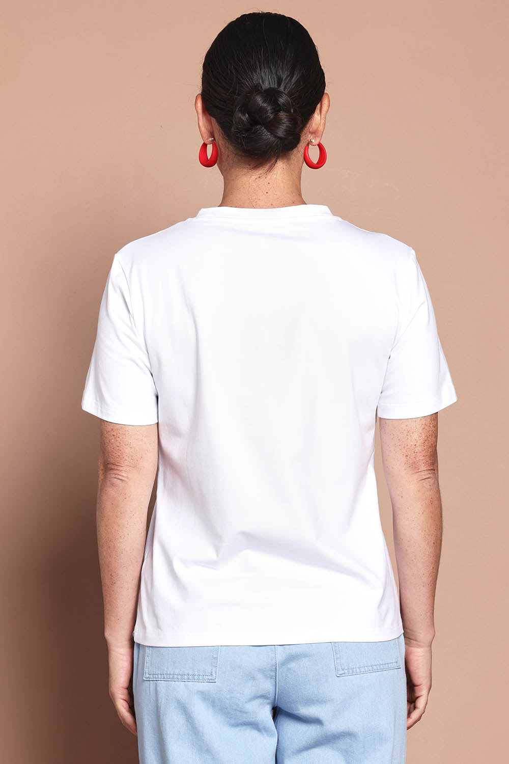 Model Katie wearing size 10 of the Mercerized Cotton Love Tee in colour White (White), from the back