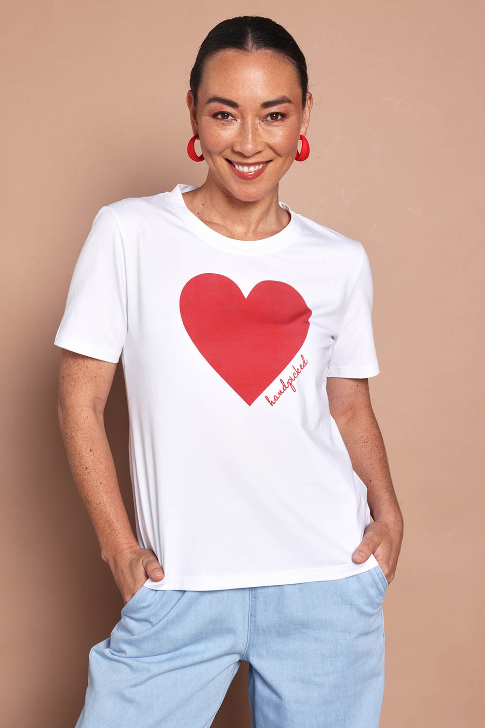 Model Katie wearing size 10 of the Mercerized Cotton Love Tee in colour White (White), from the front, cropped image