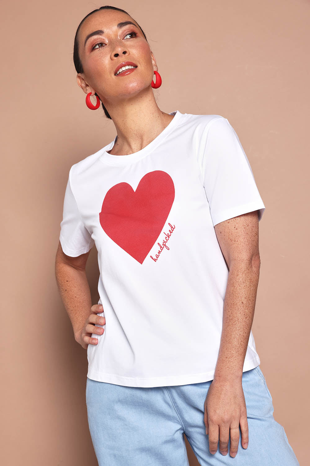 Model Katie wearing size 10 of the Mercerized Cotton Love Tee in colour White (White), from the front, cropped image