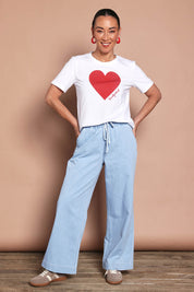 Model Katie wearing size 10 of the Mercerized Cotton Love Tee in colour White (White), from the front, showing the whole outfit