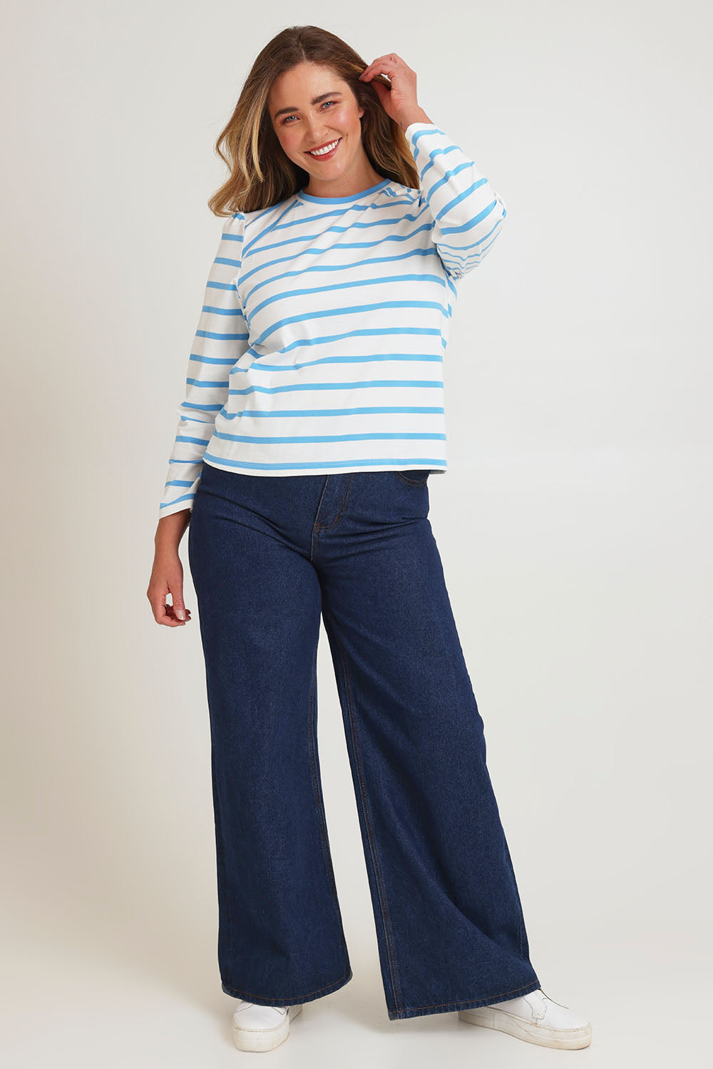 Model Chanel wearing size 16 of the Cotton Stripe Long Sleeve Top in colour Bluewhite (Blue), from the front, showing the whole outfit