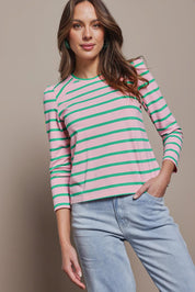 Model Madeline wearing size 10 of the Cotton Stripe Long Sleeve Top in colour Pinkgreen (Green), from the front, cropped image