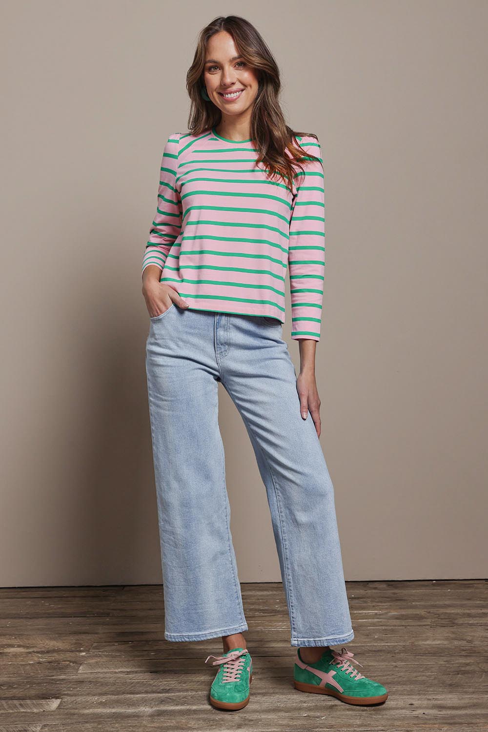 Model Madeline wearing size 10 of the Cotton Stripe Long Sleeve Top in colour Pinkgreen (Green), from the front, showing the whole outfit