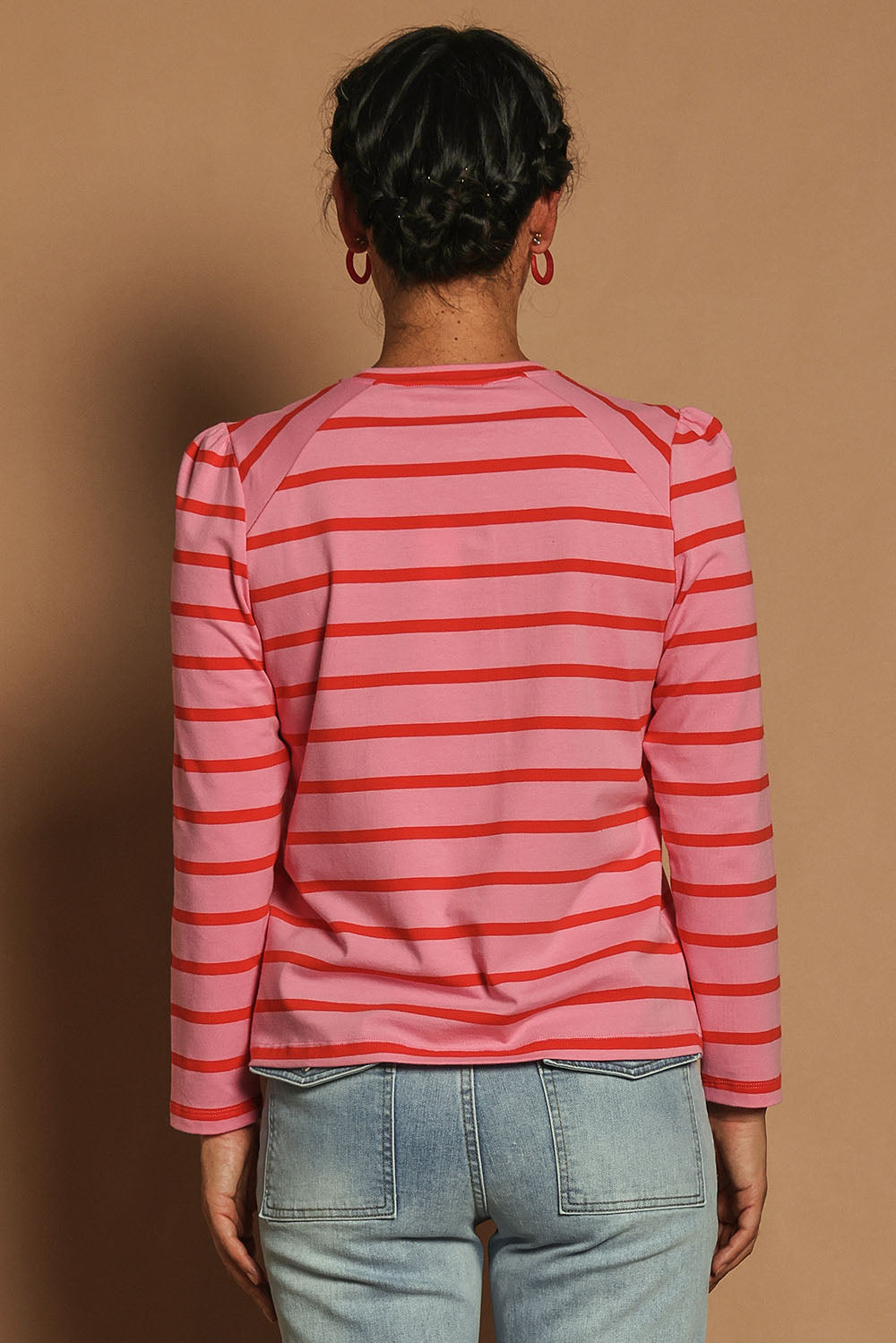 Model Katie wearing size 10 of the Cotton Stripe Long Sleeve Top in colour Redpink (Pink), from the back