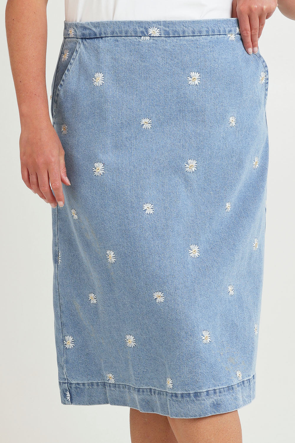 Model Chanel wearing size 16 of the Daisy Denim A Line Skirt in colour Daisy (Blue), from the front, cropped image