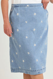 Model Chanel wearing size 16 of the Daisy Denim A Line Skirt in colour Daisy (Blue), from the front, cropped image