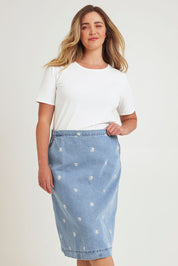 Model Chanel wearing size 16 of the Daisy Denim A Line Skirt in colour Daisy (Blue), from the front, cropped image