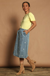 Model Katie wearing size 10 of the Daisy Denim A Line Skirt in colour Daisy (Blue), from the front, showing the whole outfit
