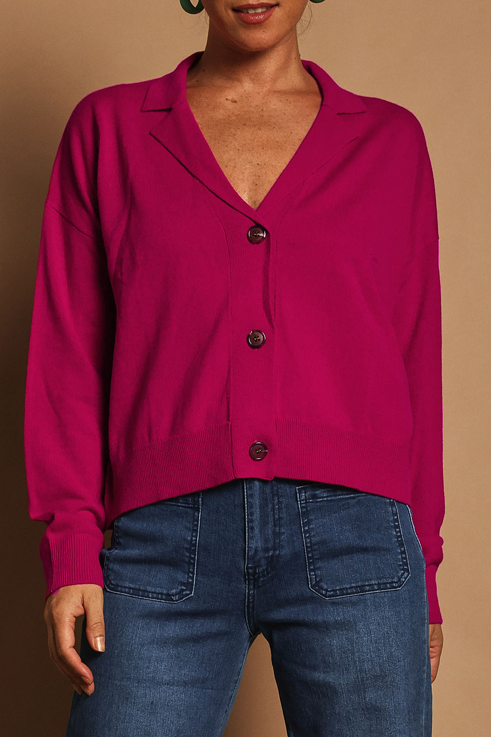 Model Katie wearing size S of the Relaxed Collar Cardigan in colour Fuschia (Pink), from the front, cropped image