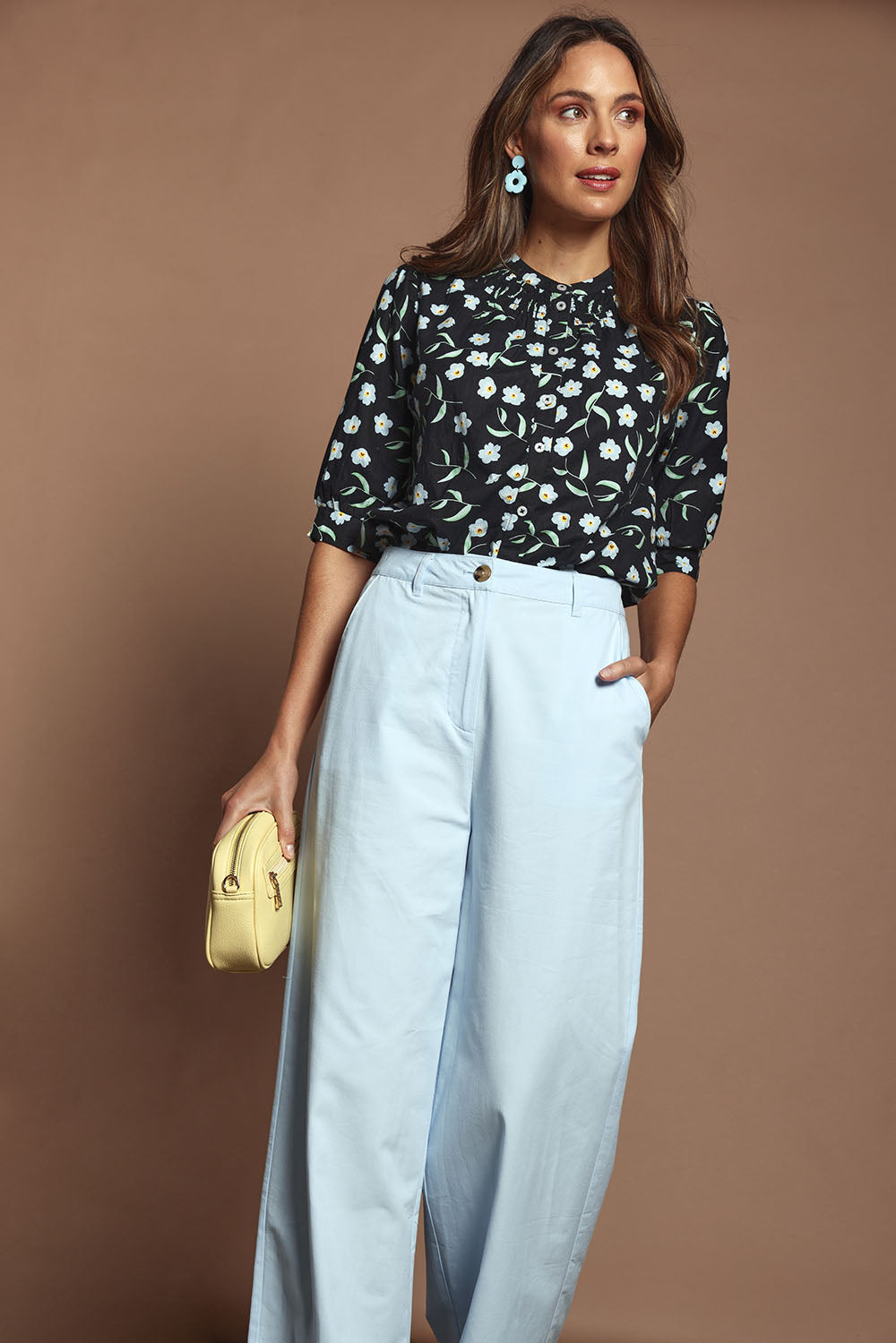 Model Madeline wearing size 10 of the Cotton Button Up Shirt in colour Floret (Black), from the front, showing the whole outfit