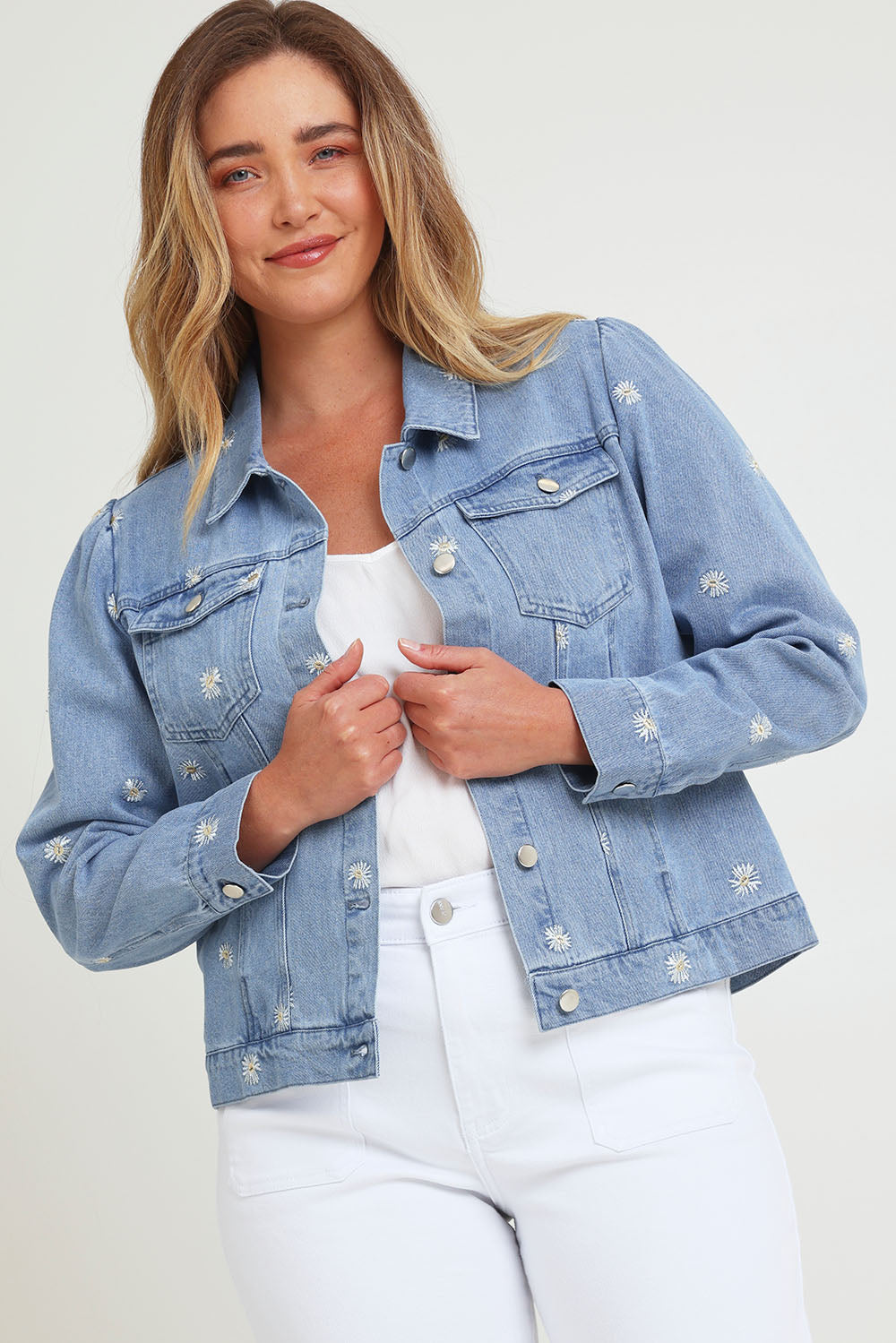 Model Chanel wearing size 16 of the Daisy Denim Jacket in colour Daisy (Blue), from the front, cropped image