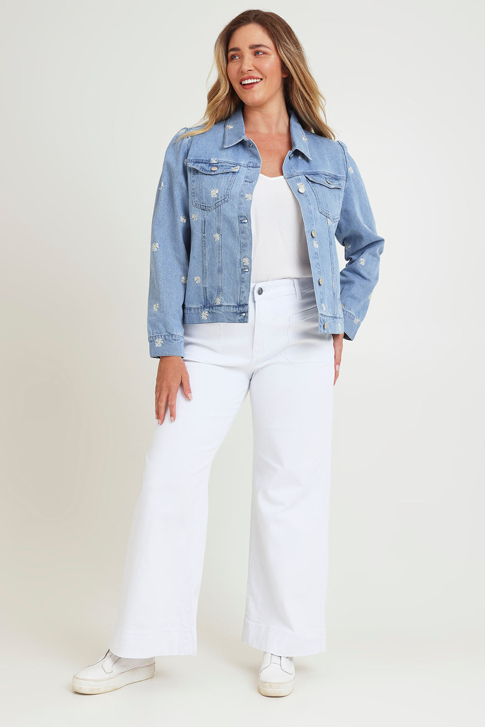 Model Chanel wearing size 16 of the Daisy Denim Jacket in colour Daisy (Blue), from the front, showing the whole outfit