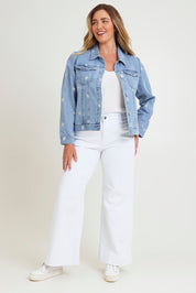 Model Chanel wearing size 16 of the Daisy Denim Jacket in colour Daisy (Blue), from the front, showing the whole outfit