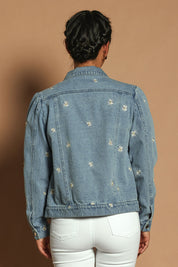 Model Katie wearing size 10 of the Daisy Denim Jacket in colour Daisy (Blue), from the back
