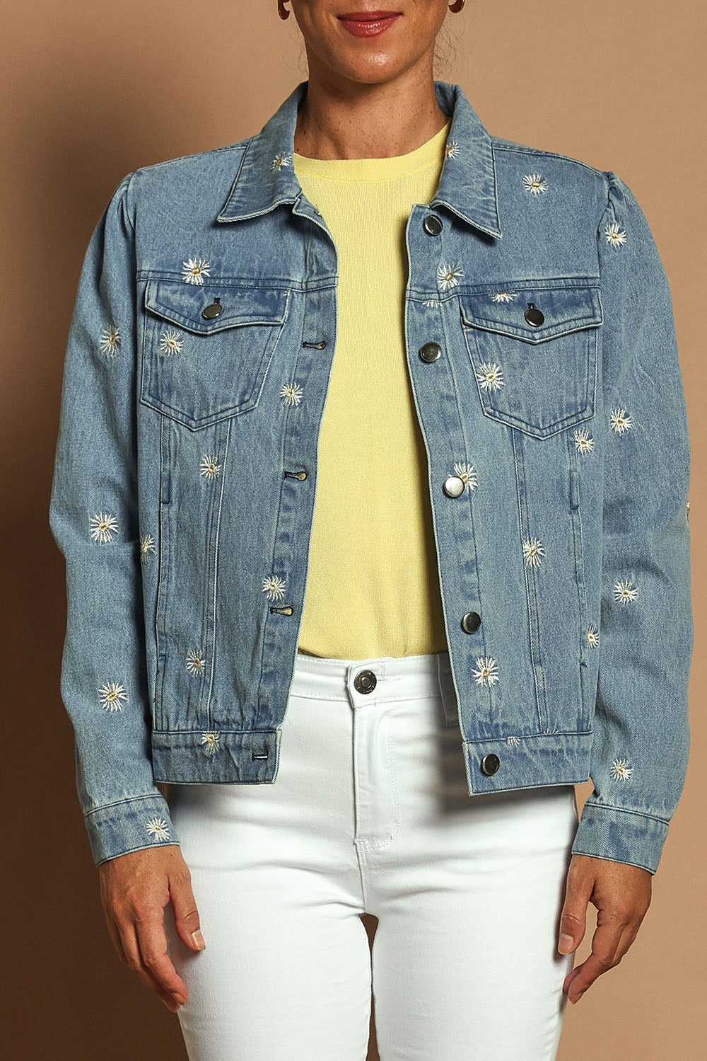 Model Katie wearing size 10 of the Daisy Denim Jacket in colour Daisy (Blue), from the front, cropped image