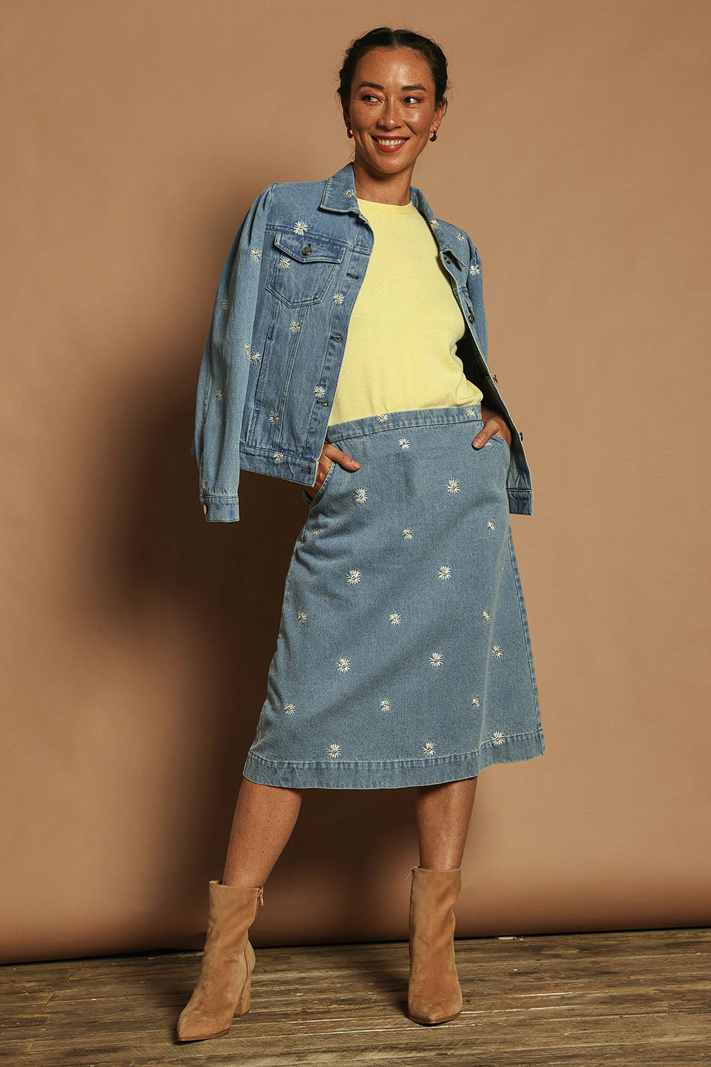 Model Katie wearing size 10 of the Daisy Denim Jacket in colour Daisy (Blue), from the front, showing the whole outfit