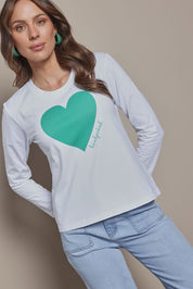 Model Madeline wearing size 10 of the Mercerized Cotton Love Long Sleeve Tee in colour Green (Green), from the front, cropped image