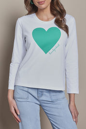 Model Madeline wearing size 10 of the Mercerized Cotton Love Long Sleeve Tee in colour Green (Green), from the front, cropped image