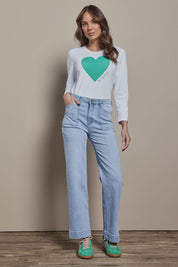 Model Madeline wearing size 10 of the Mercerized Cotton Love Long Sleeve Tee in colour Green (Green), from the front, showing the whole outfit